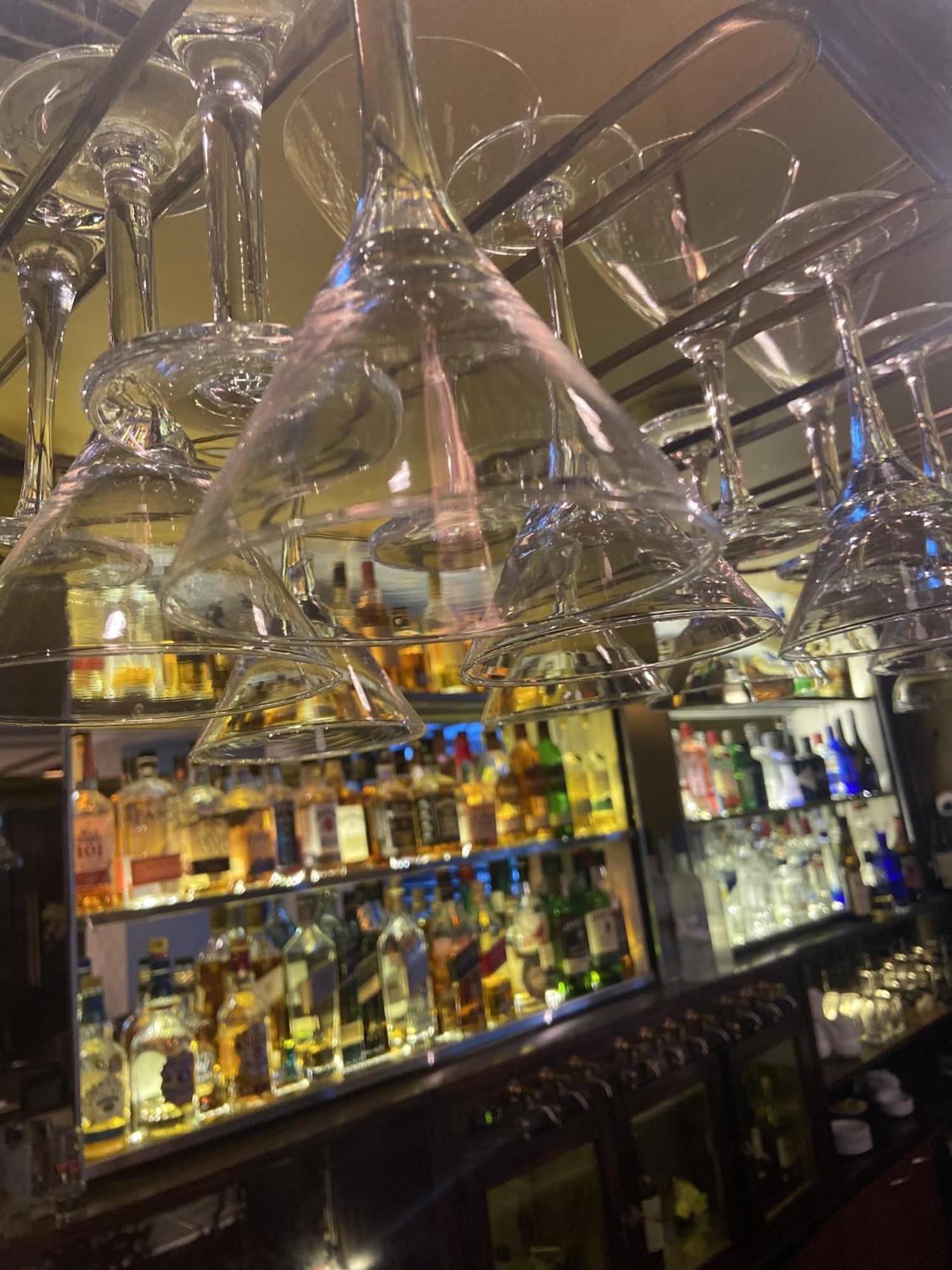 Regal Pacific Puerto Madero Hotel Buenos Aires Ngoại thất bức ảnh Wine glasses hanging above a bar